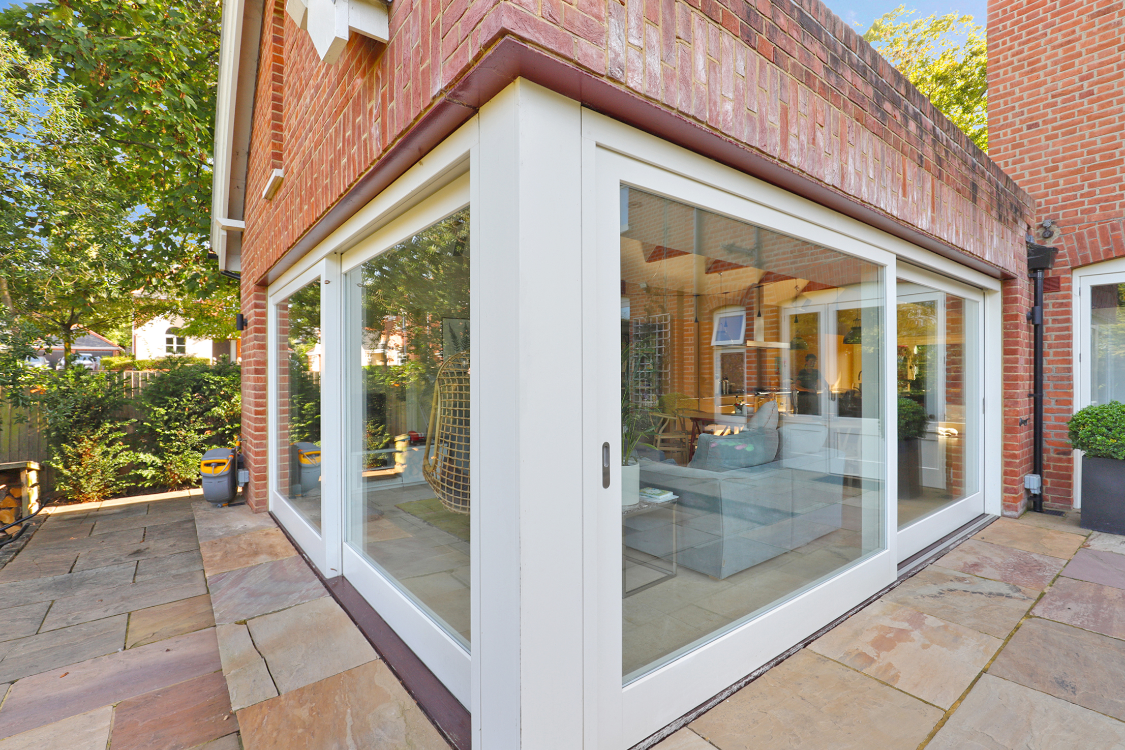 Large sliding door on extension corner K and D Joinery bespoke